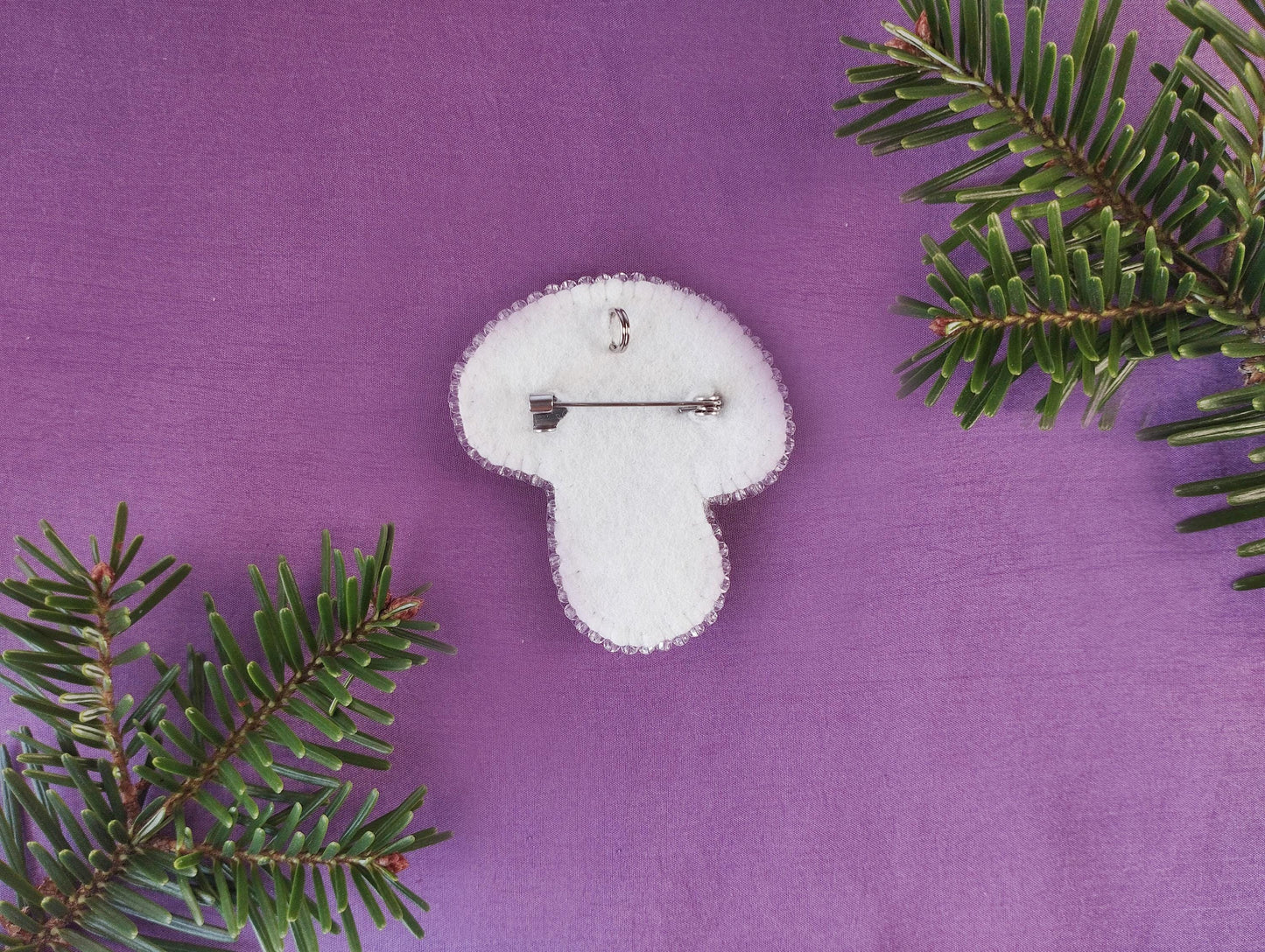 a white clock sitting on top of a purple surface