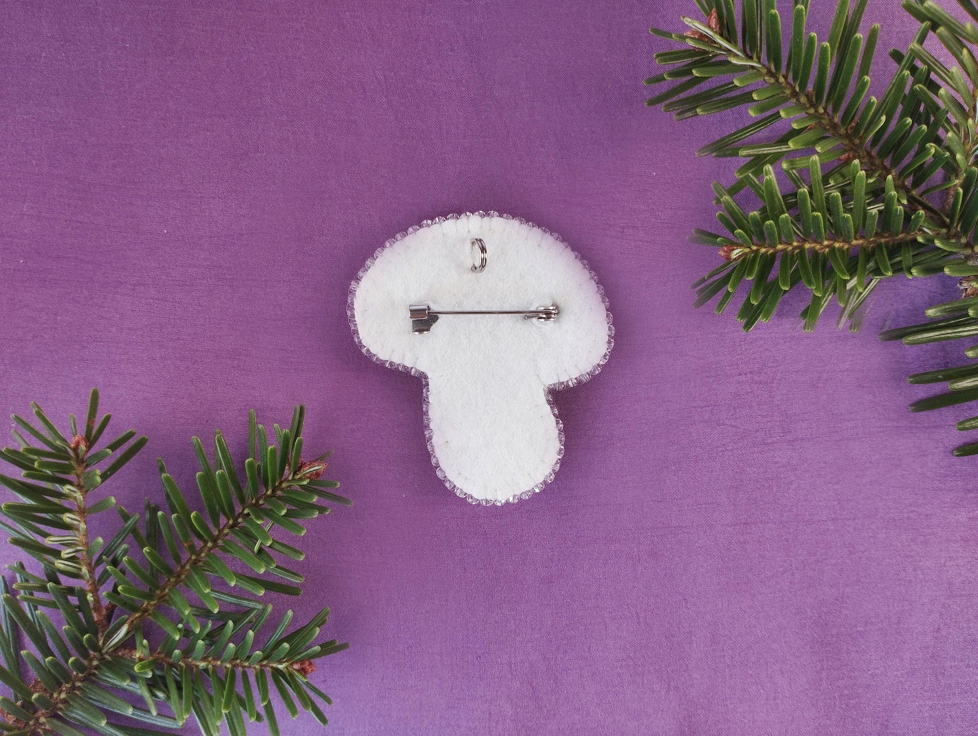 a white clock sitting on top of a purple surface
