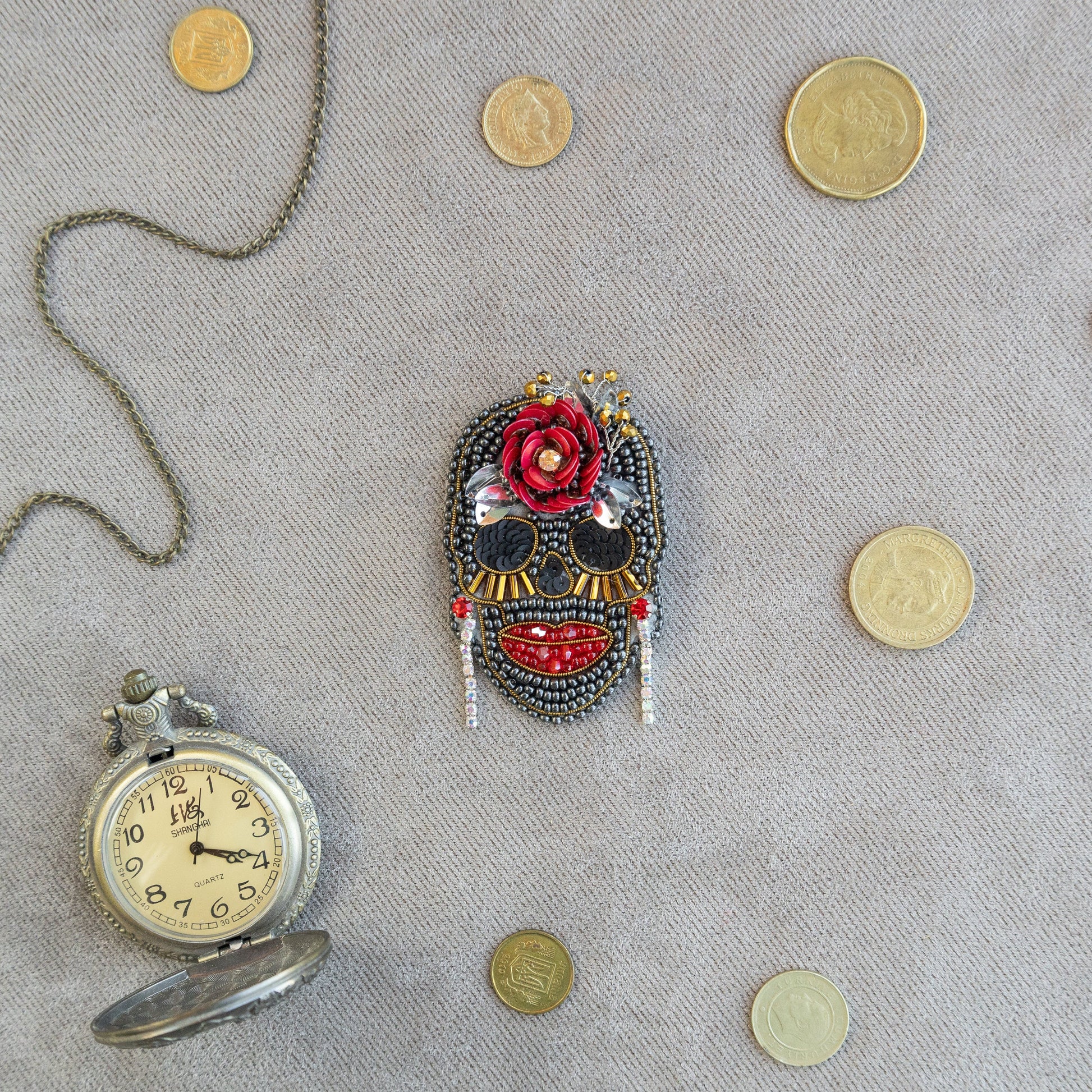 a clock and a mask on a table
