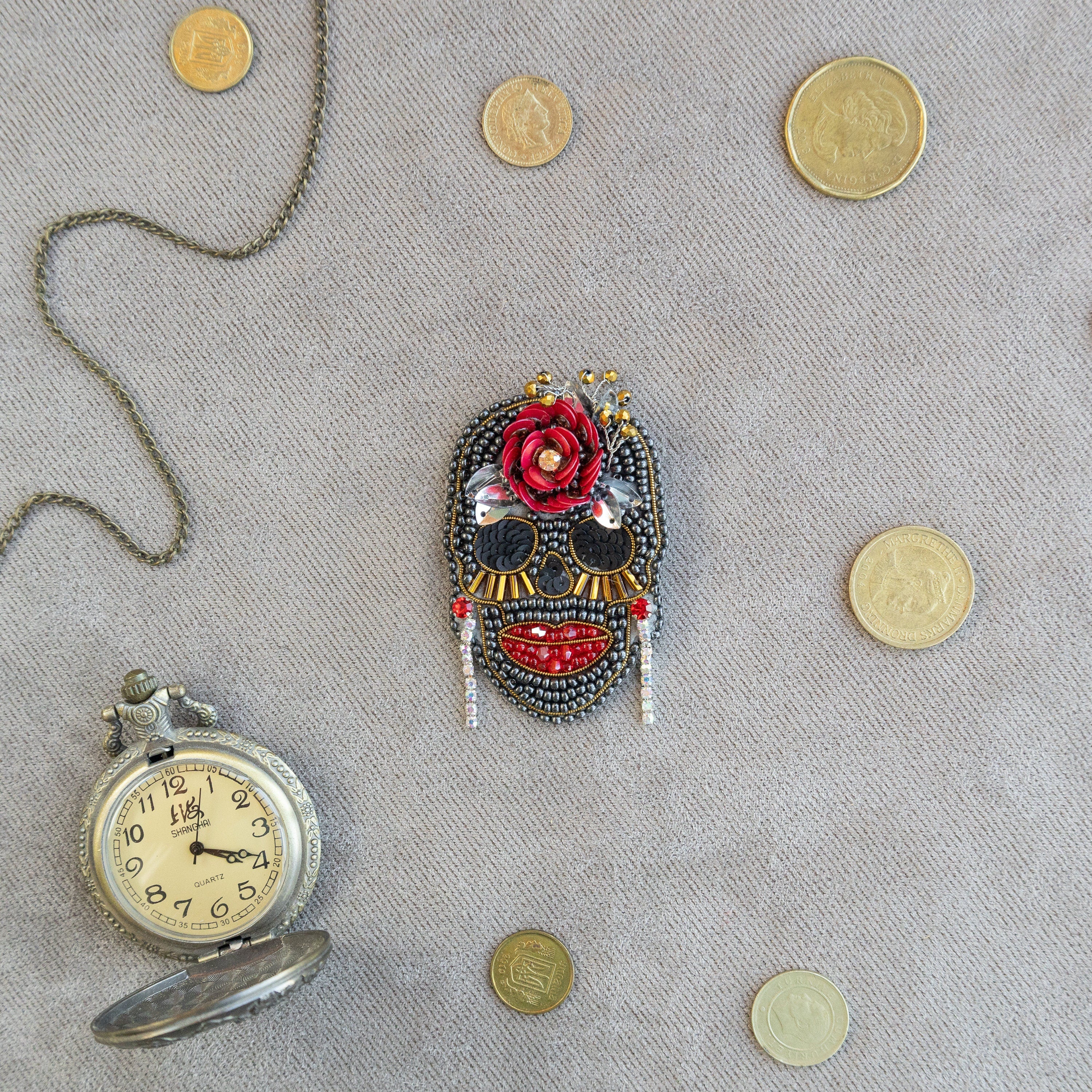 a clock and a mask on a table