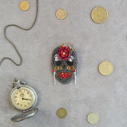 a clock and a mask on a table