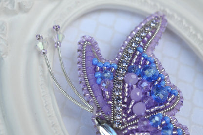 a close up of a beaded object on a plate