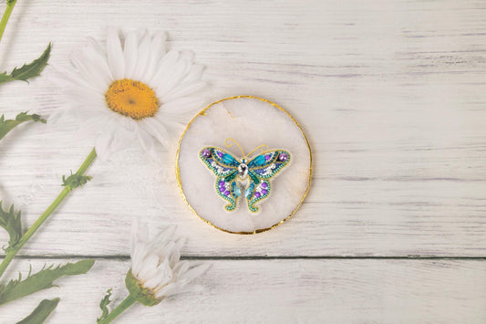 a picture of a butterfly on a piece of wood