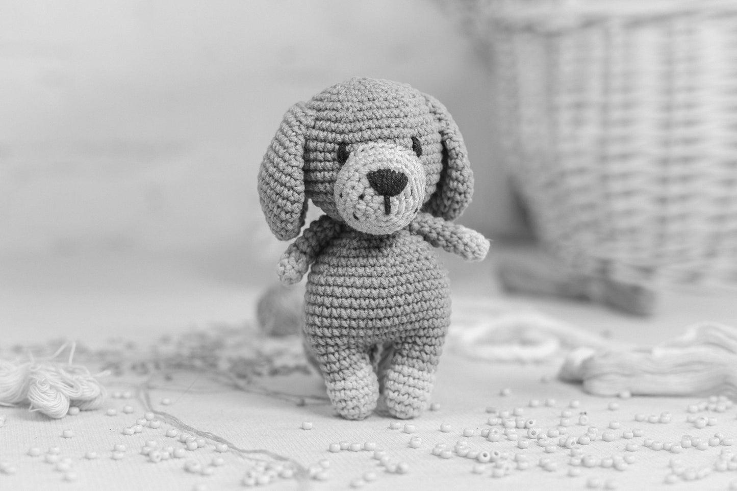 a small crocheted dog sitting on top of a table