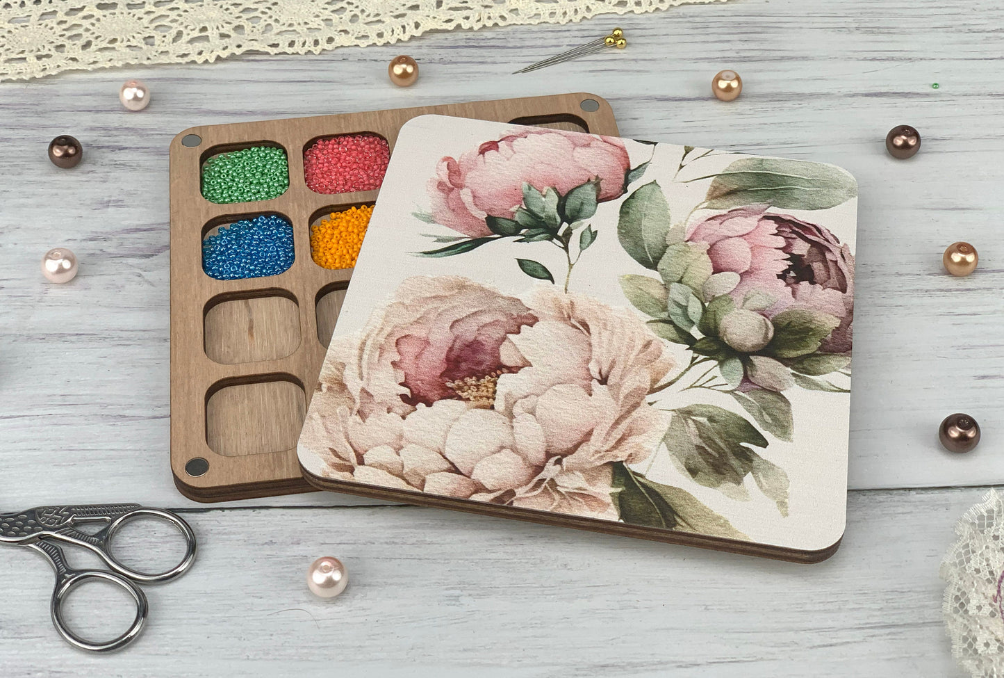 a wooden box with a flower painted on it
