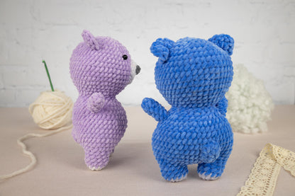 a couple of stuffed animals sitting next to each other