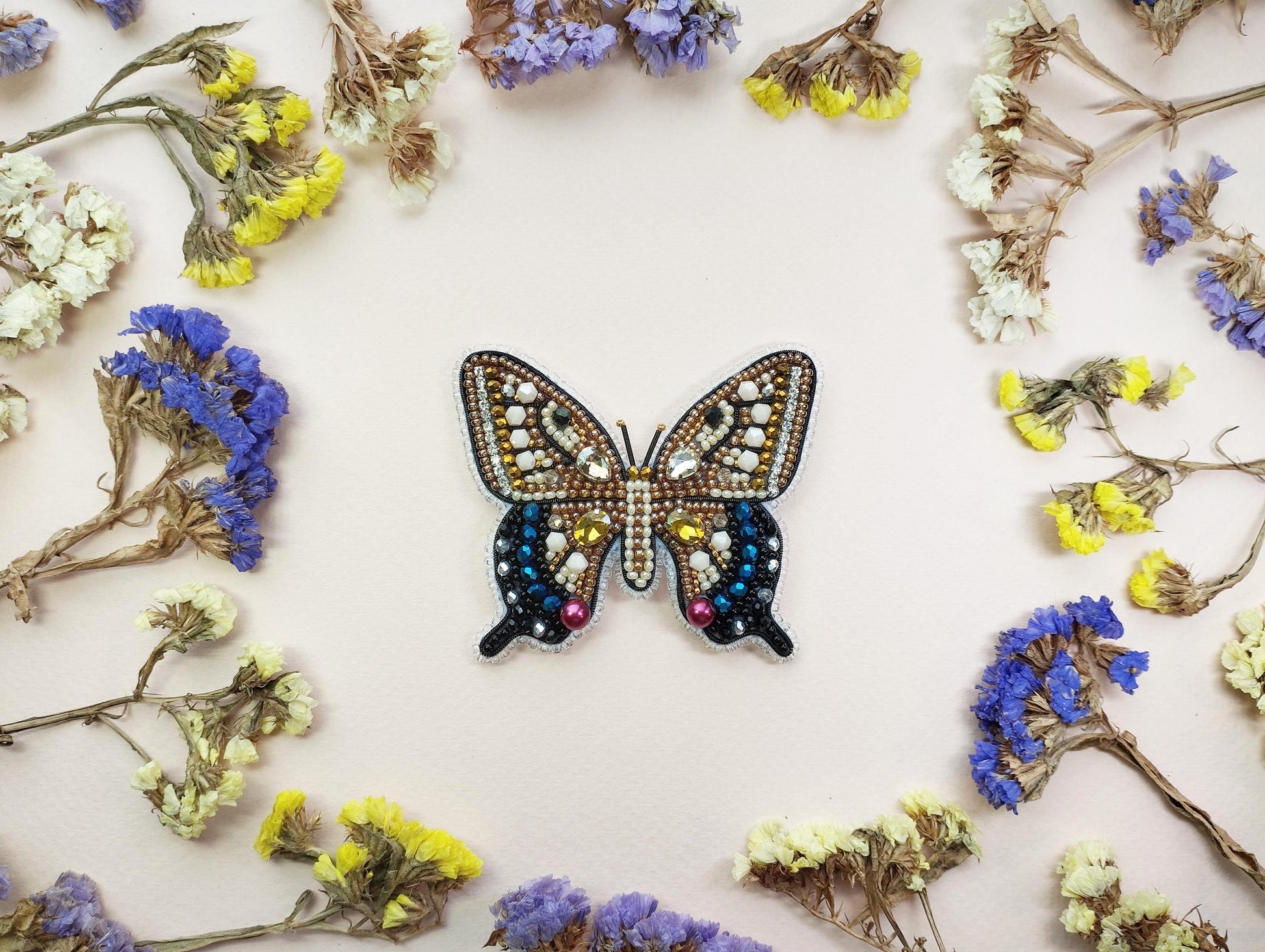 a picture of a butterfly made out of beads