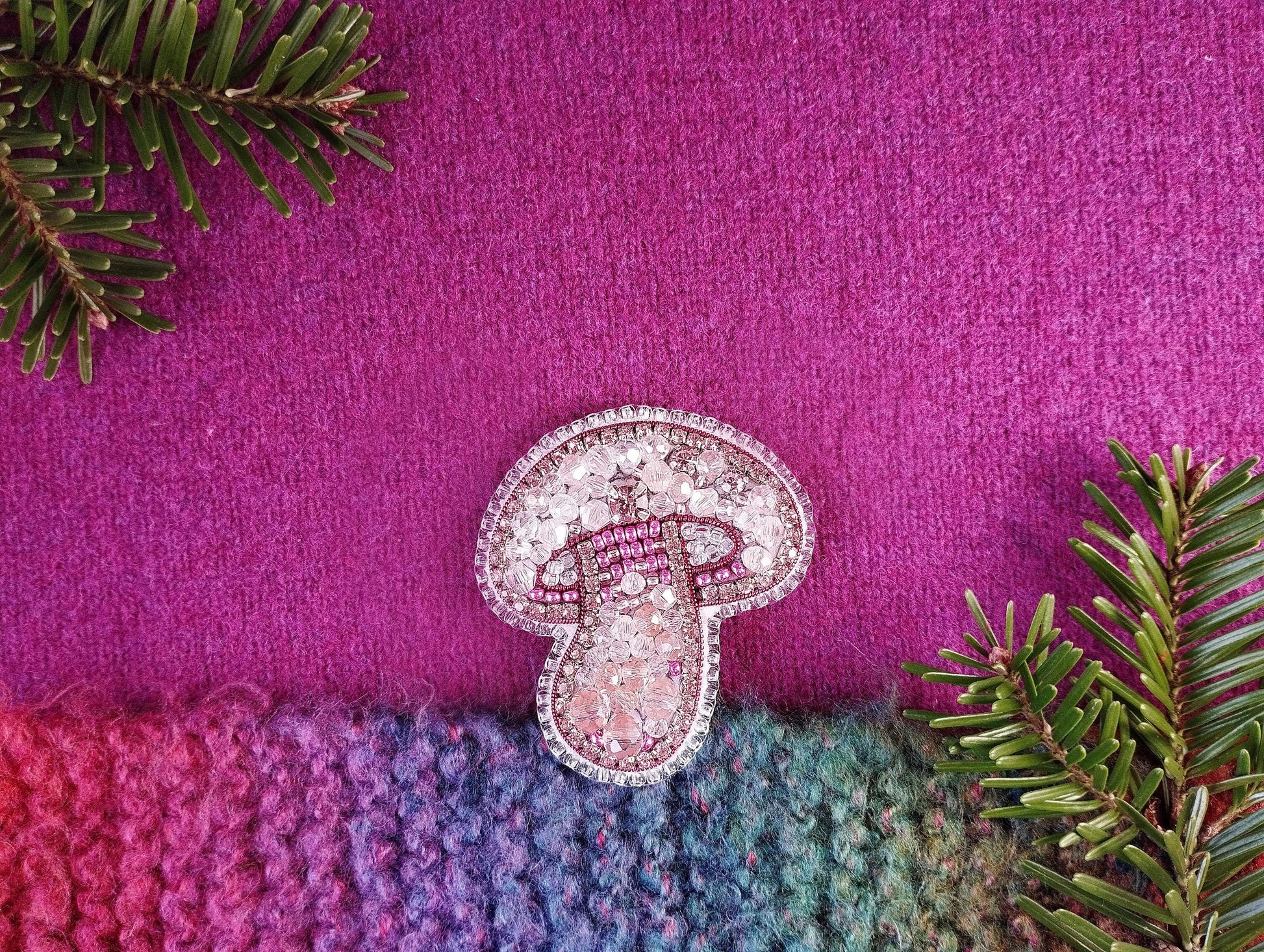 a pair of shoes sitting on top of a purple blanket