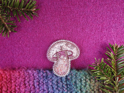 a pair of shoes sitting on top of a purple blanket