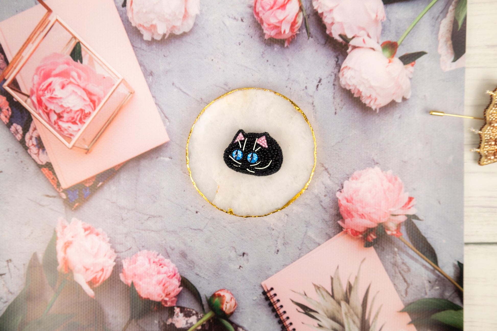 a cake with a black cat on top of it