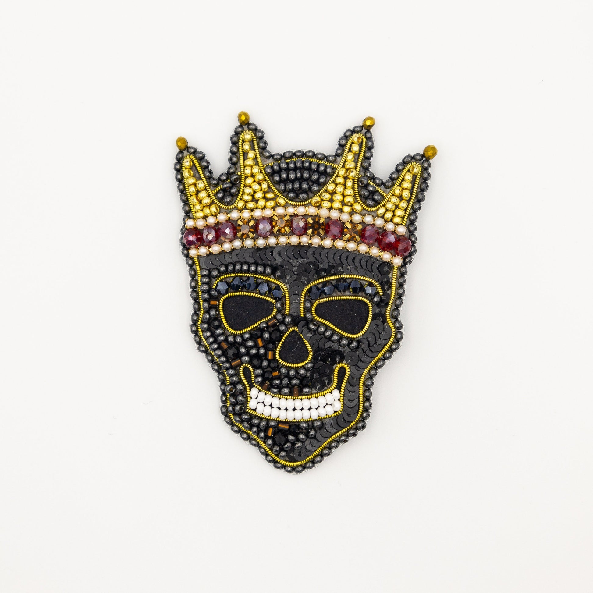 a black mask with a crown on top of it