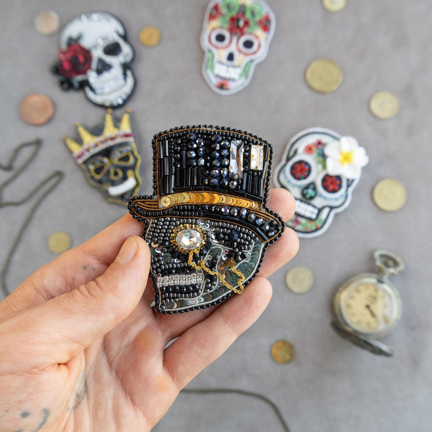 a person holding a brooch in their hand