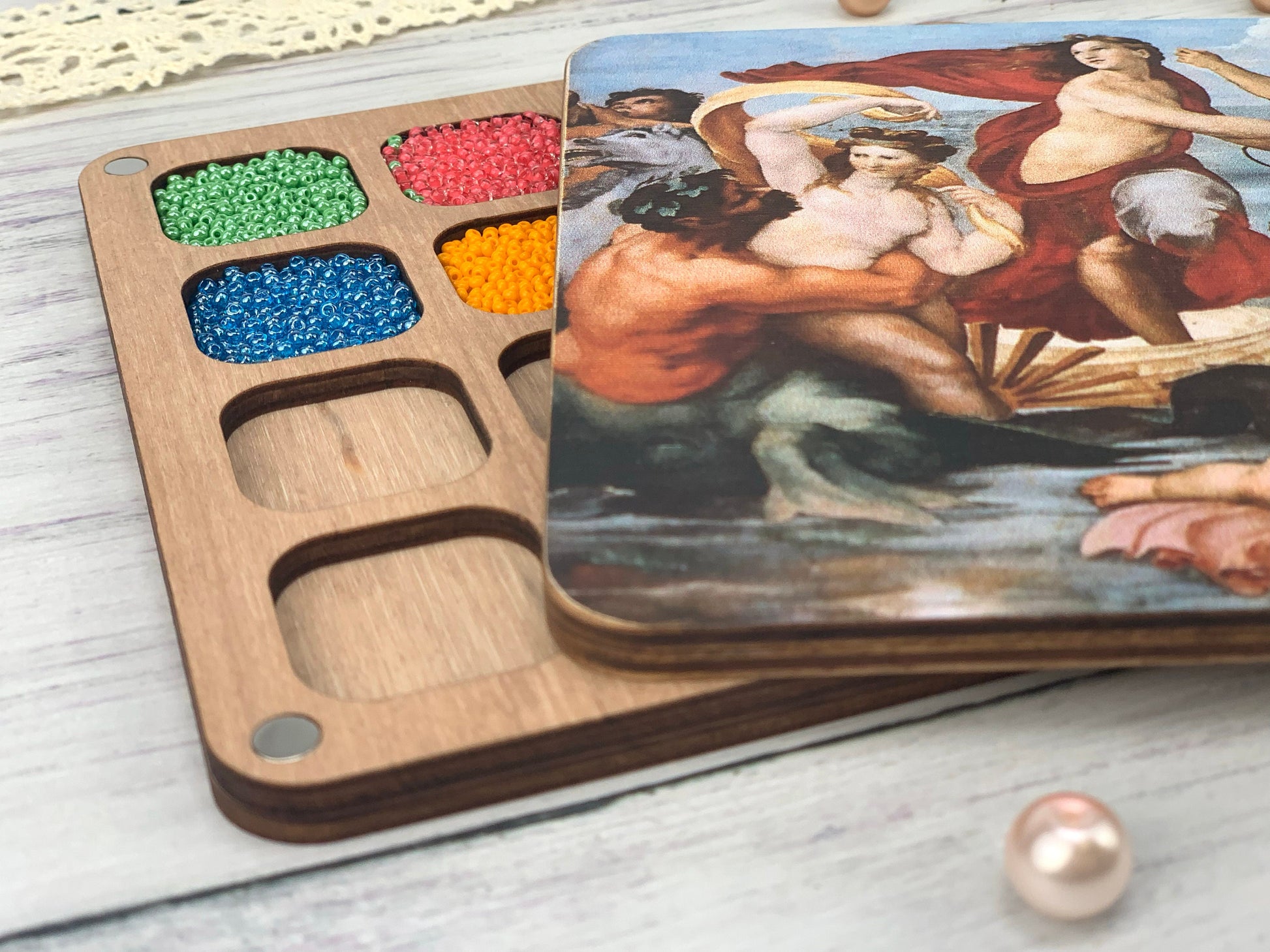 a wooden tray with a painting on it