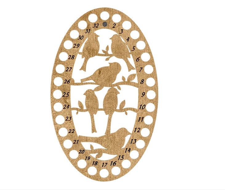 a wooden cutout of birds on a tree branch