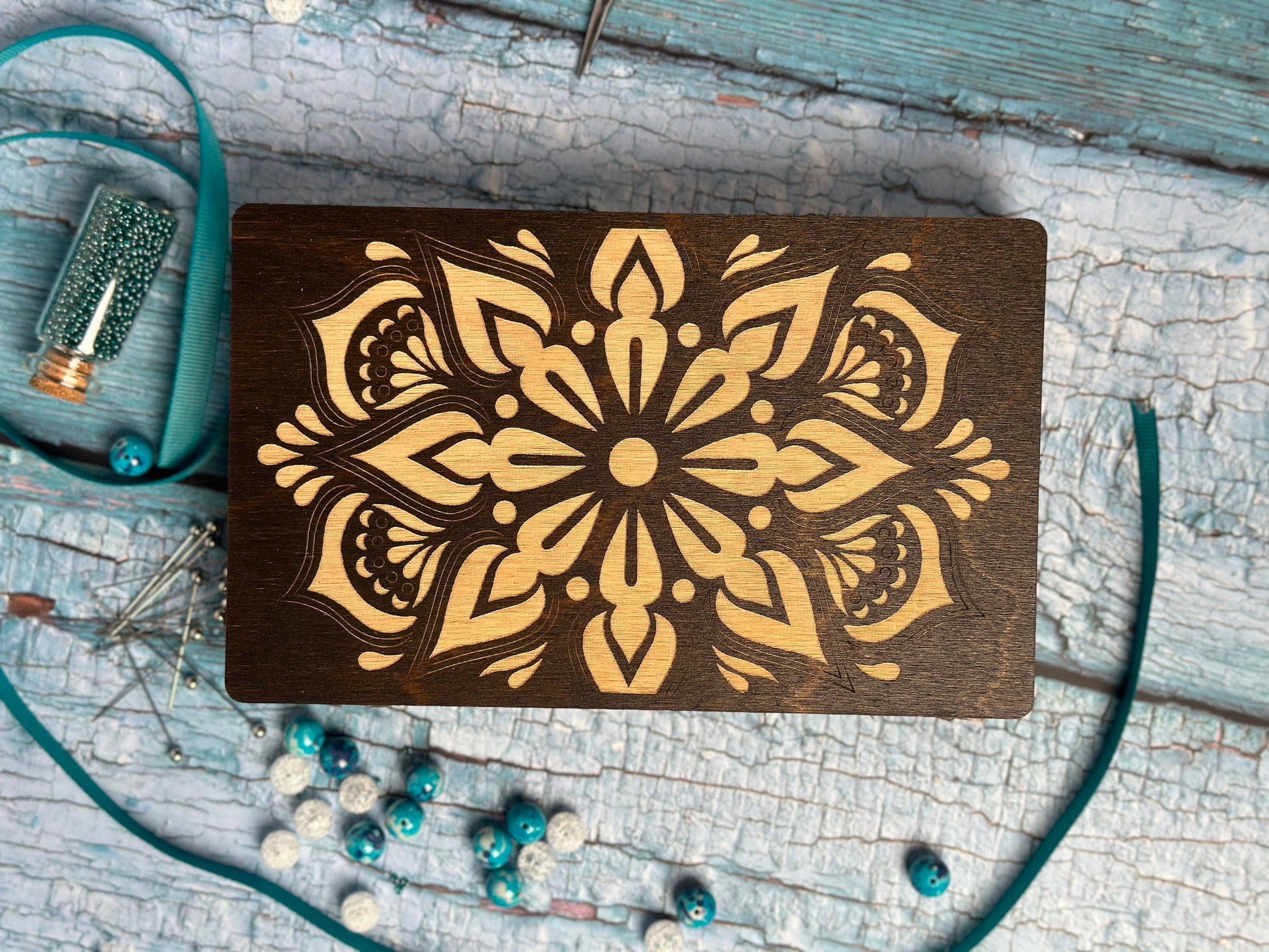 a wooden board with a flower design on it