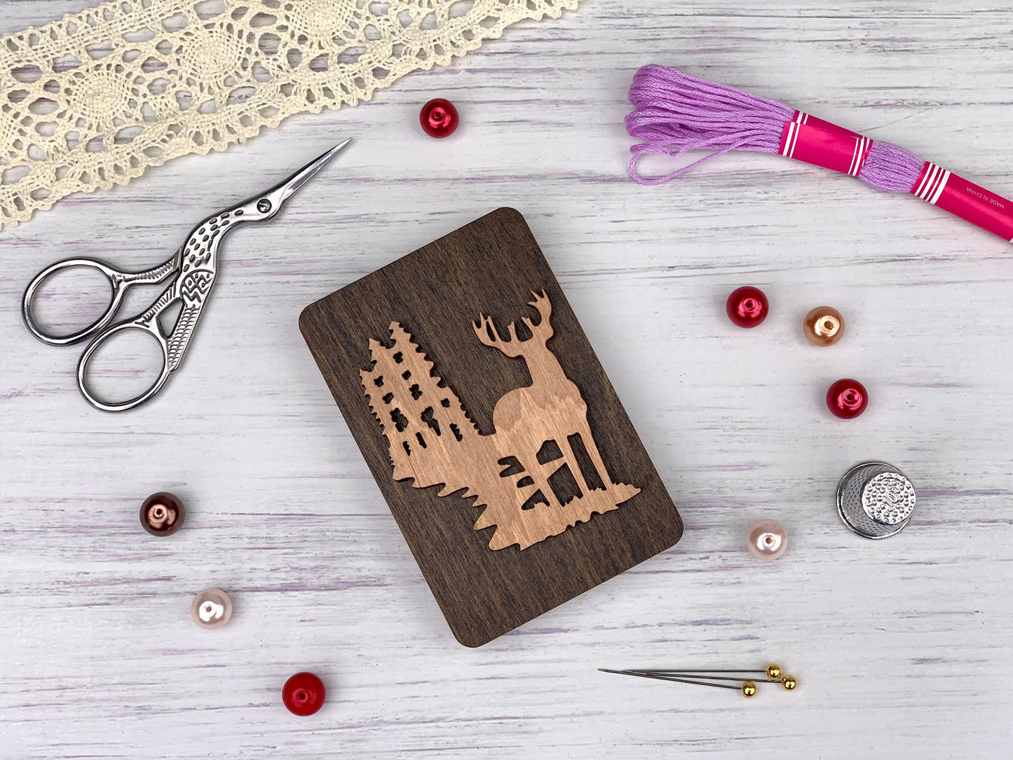 a wooden cutting board with a picture of a deer