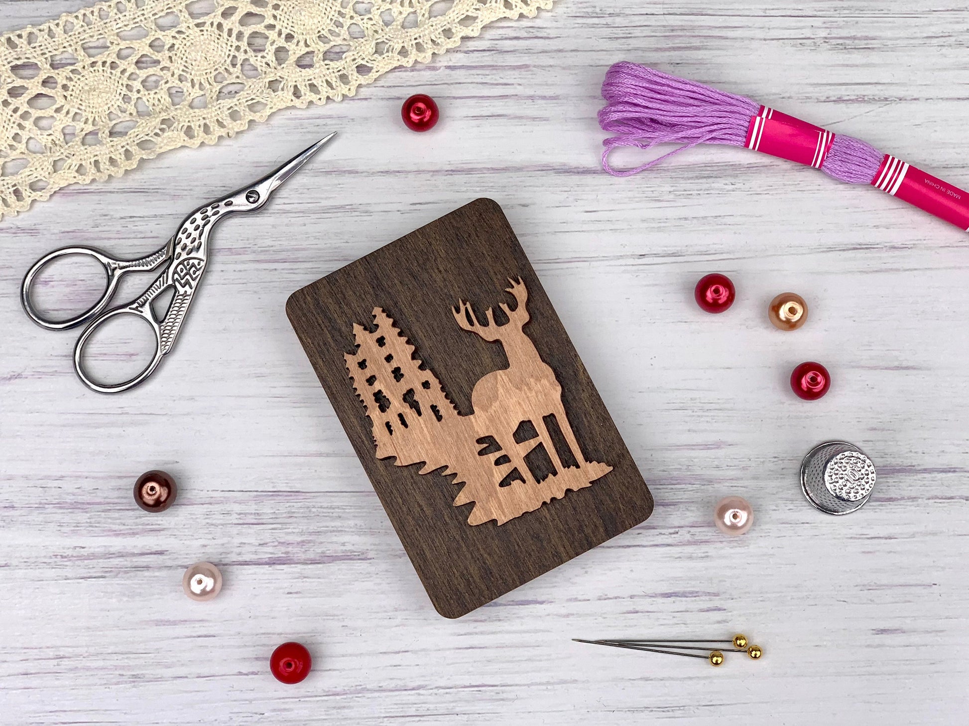 a wooden cutting board with a picture of a deer