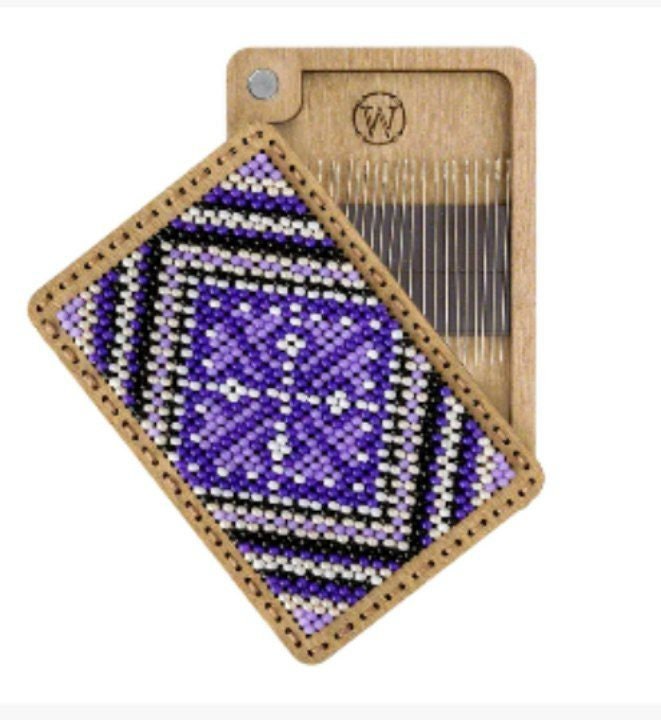 a piece of wood with a picture of a purple object on it