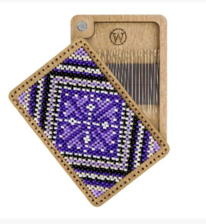 a piece of wood with a picture of a purple object on it