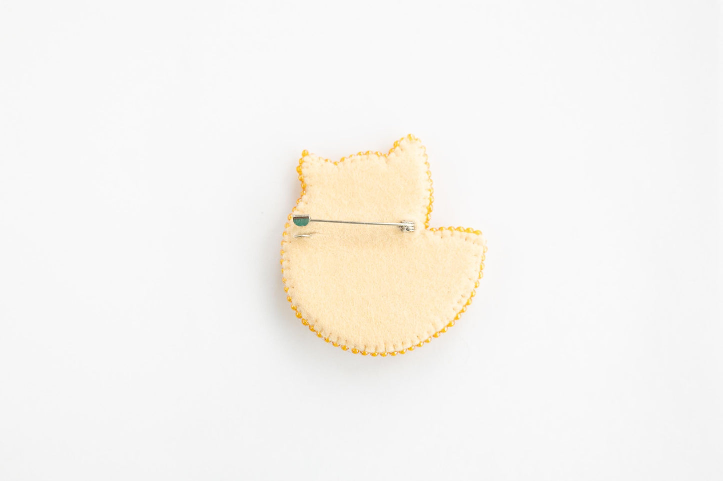 a pin with a cat design on it