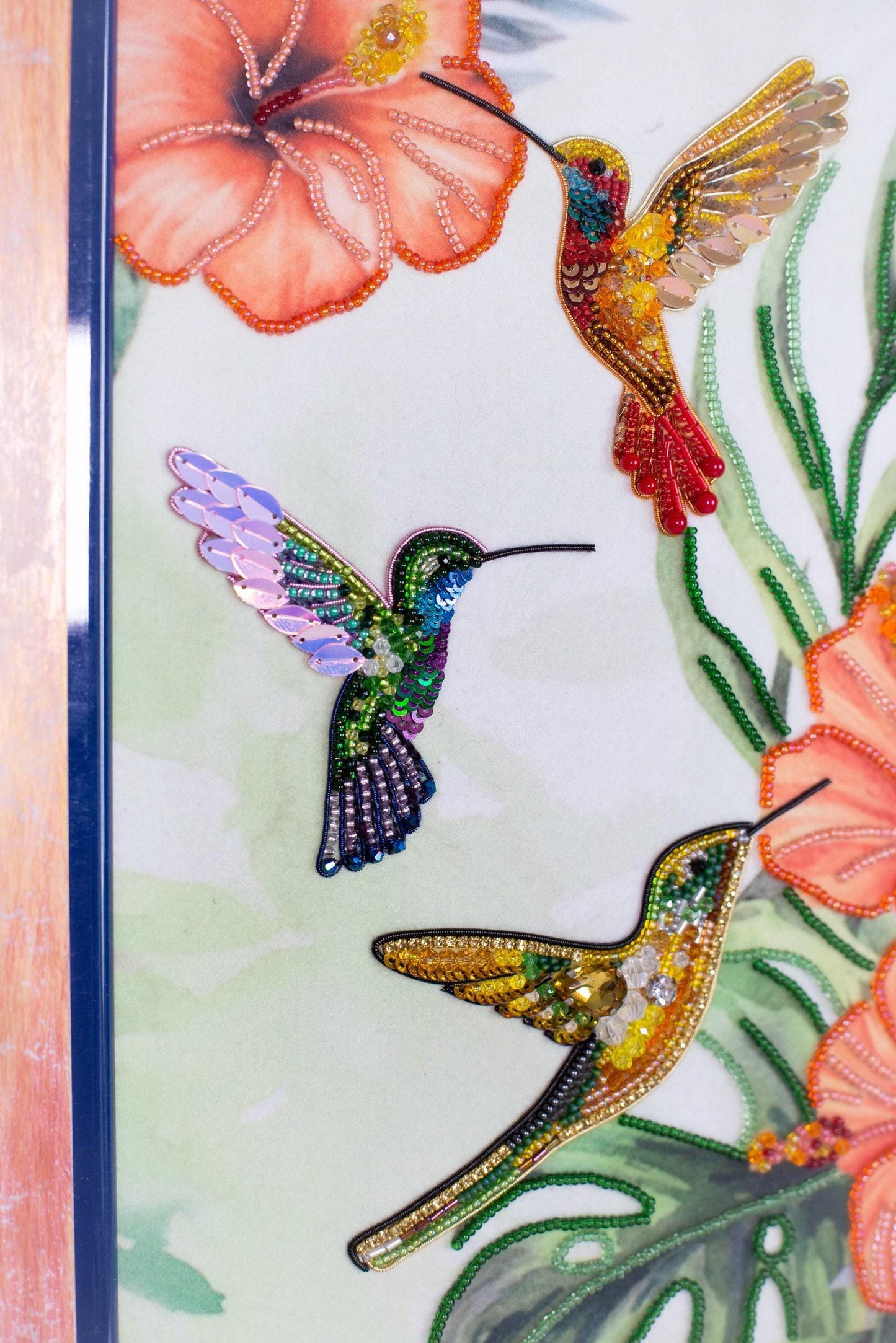 a picture of a picture of a hummingbird and flowers
