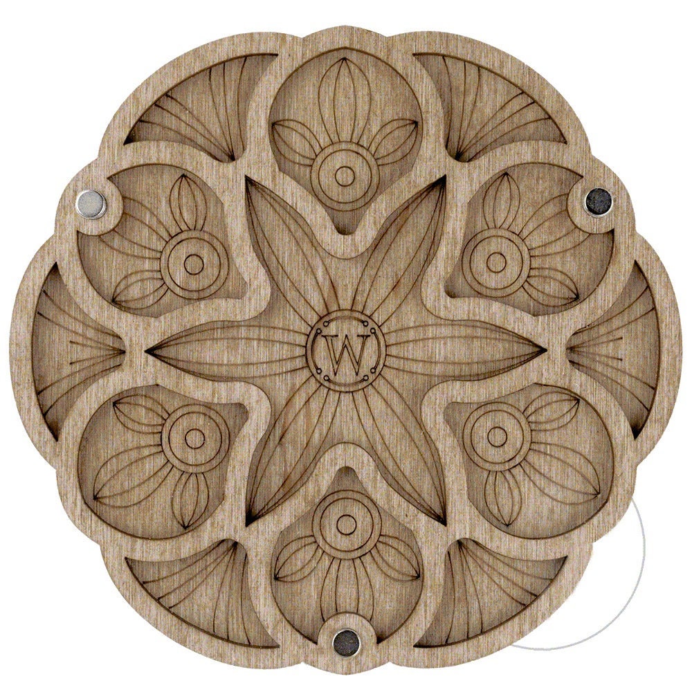 a wooden plate with a design on it