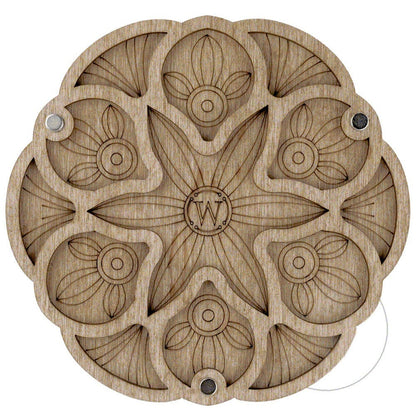 a wooden plate with a design on it