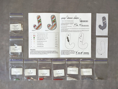 various craft supplies and materials, including bags of beads, string, and other embellishments, arranged on a table.