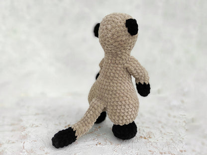 a crocheted stuffed animal sitting on top of a white surface
