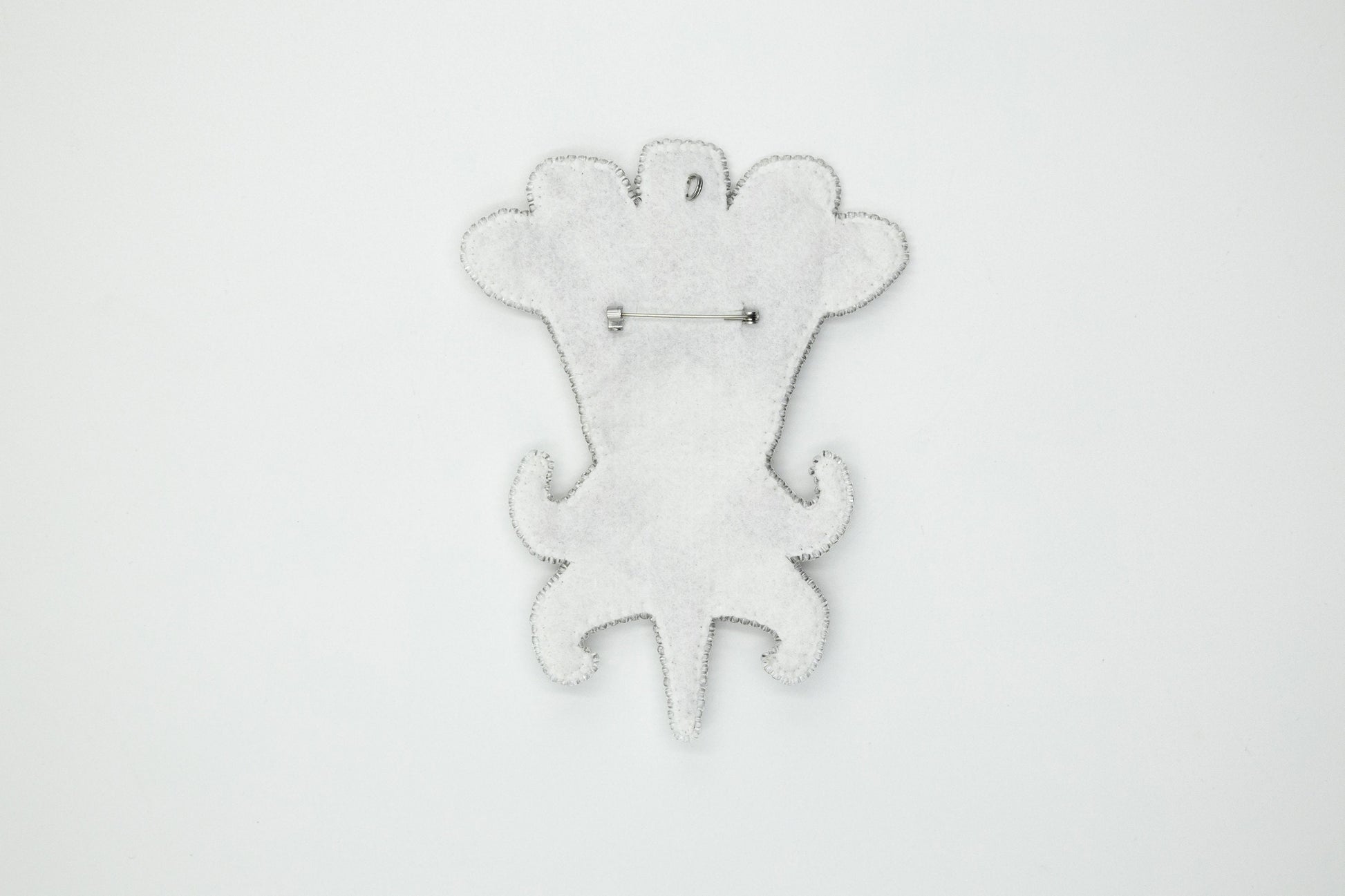 a white clock with a monkey design on it