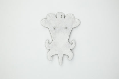 a white clock with a monkey design on it