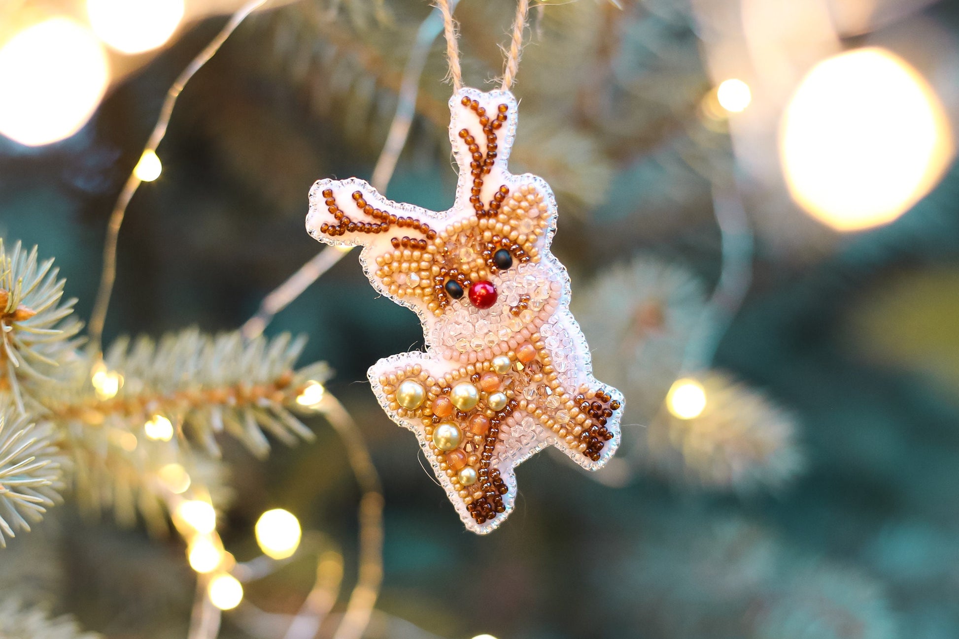a christmas ornament hanging from a christmas tree