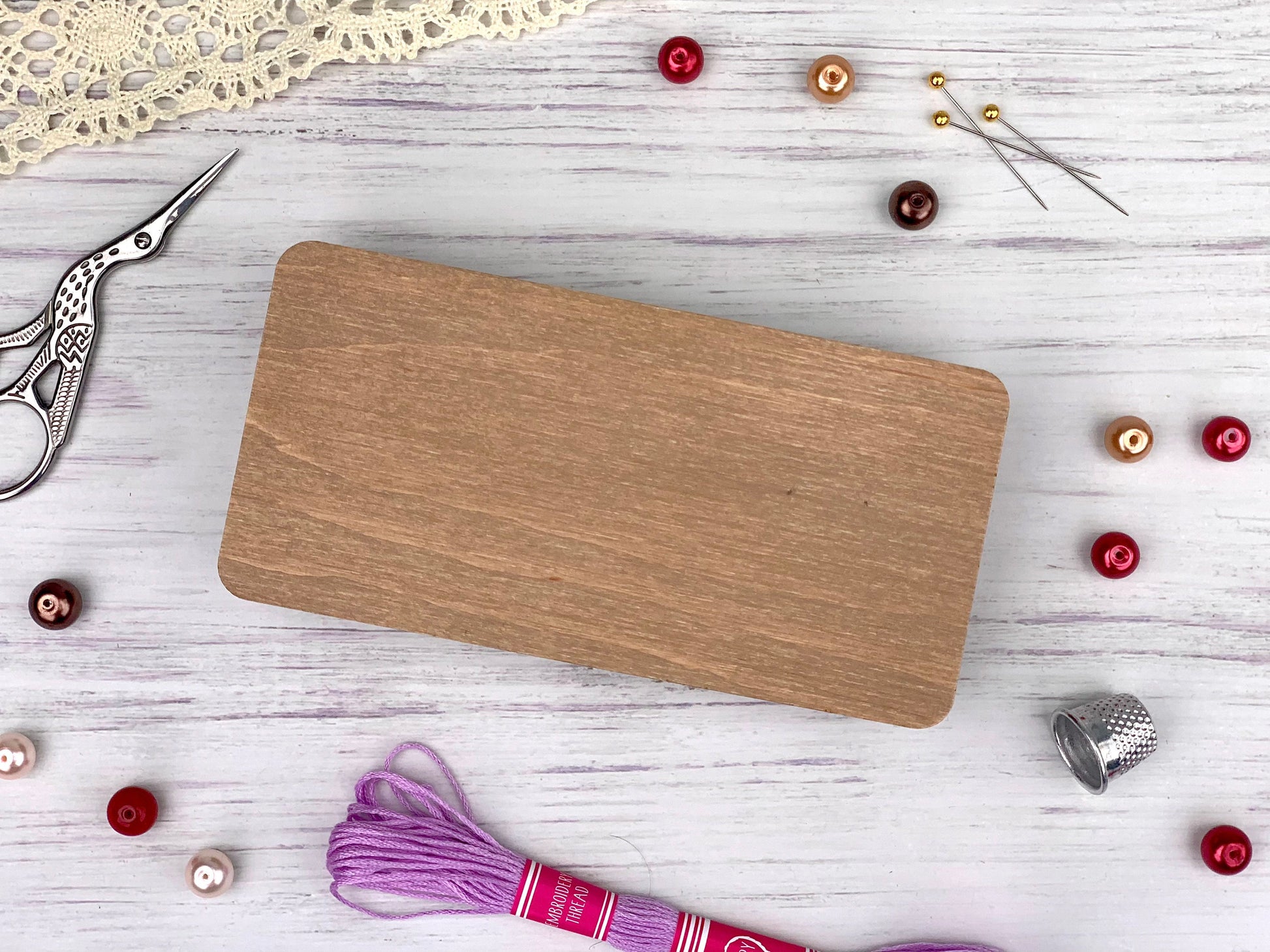 a wooden cutting board sitting on top of a white table
