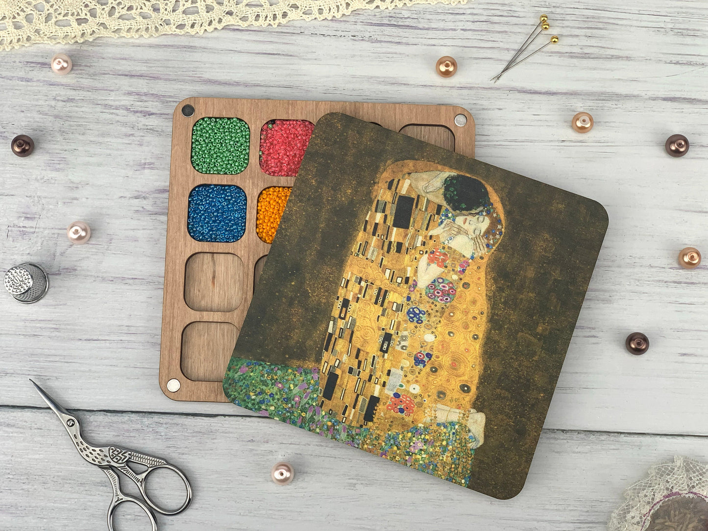 a wooden cutting board with a picture of a painting on it