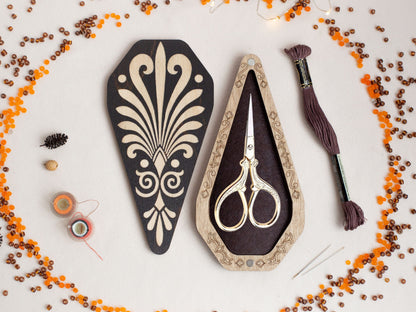 a pair of scissors sitting on top of a table