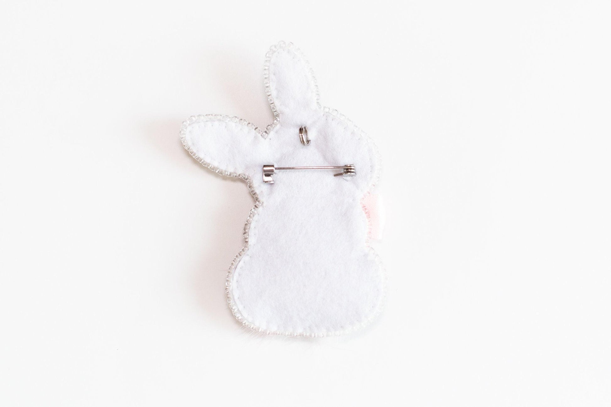 a white rabbit shaped object on a white surface