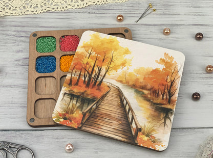 a watercolor painting of a bridge in the woods