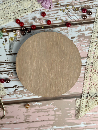 a wooden circle sitting on top of a table
