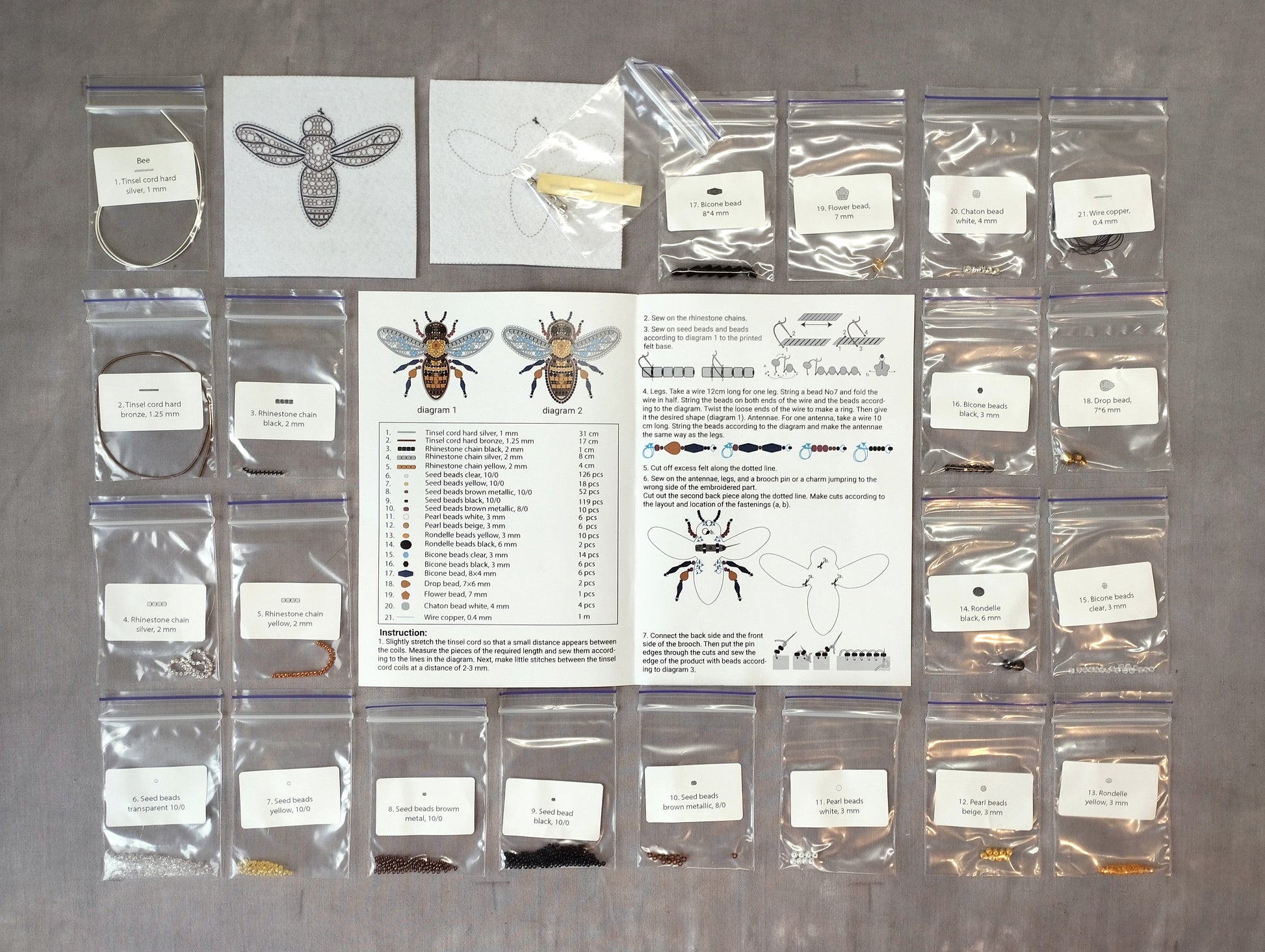 various items related to beekeeping, including a bee, a diagram, and several bags of different sizes and materials.