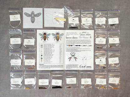 various items related to beekeeping, including a bee, a diagram, and several bags of different sizes and materials.