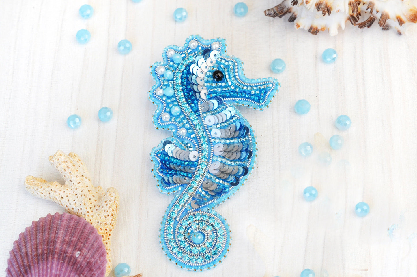 a seahorse is made out of beads and beads