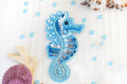 a seahorse is made out of beads and beads