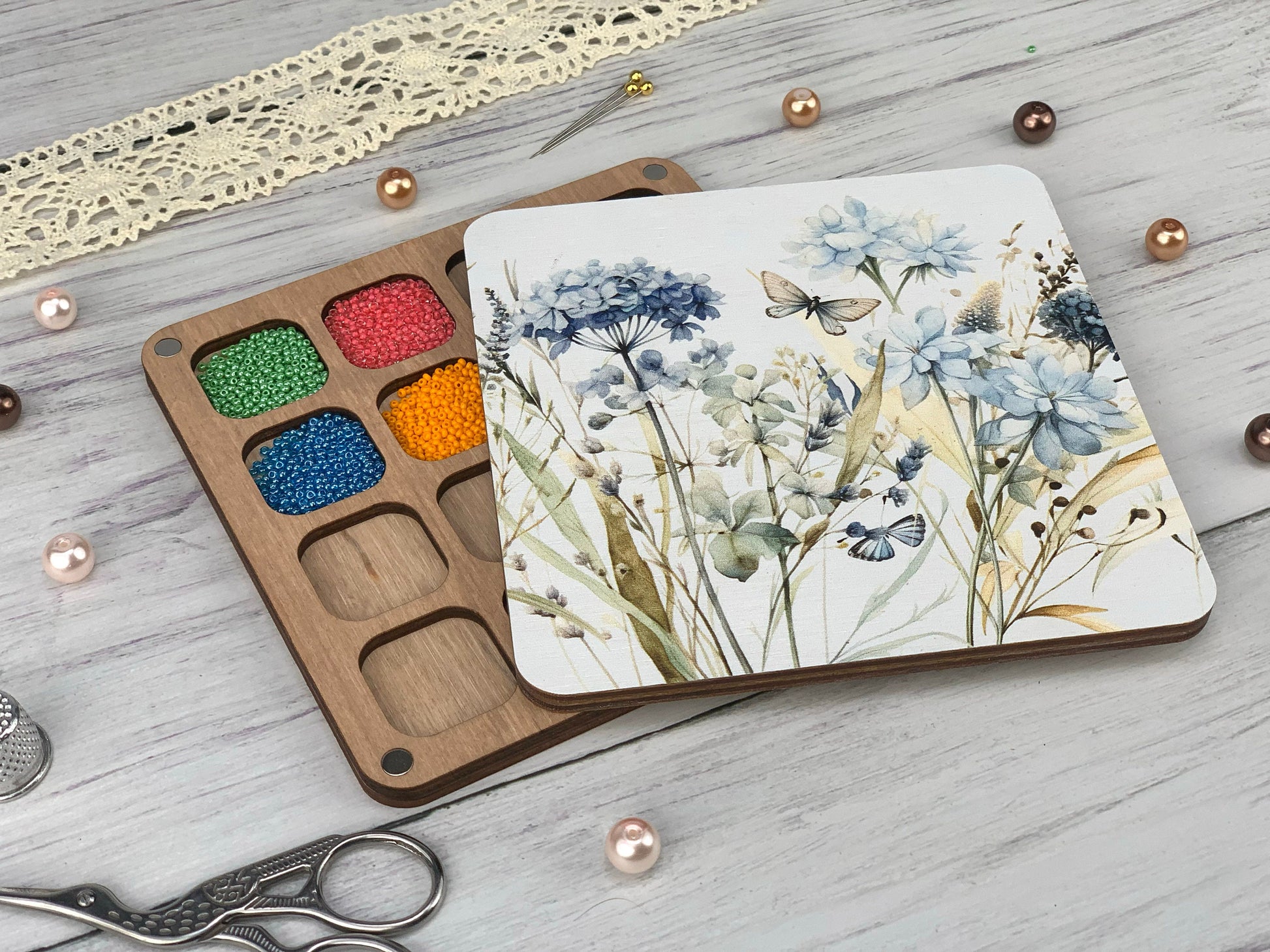 a wooden tray with paint and a pair of scissors