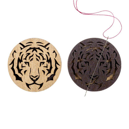 two wooden coasters with designs of a tiger and a tiger