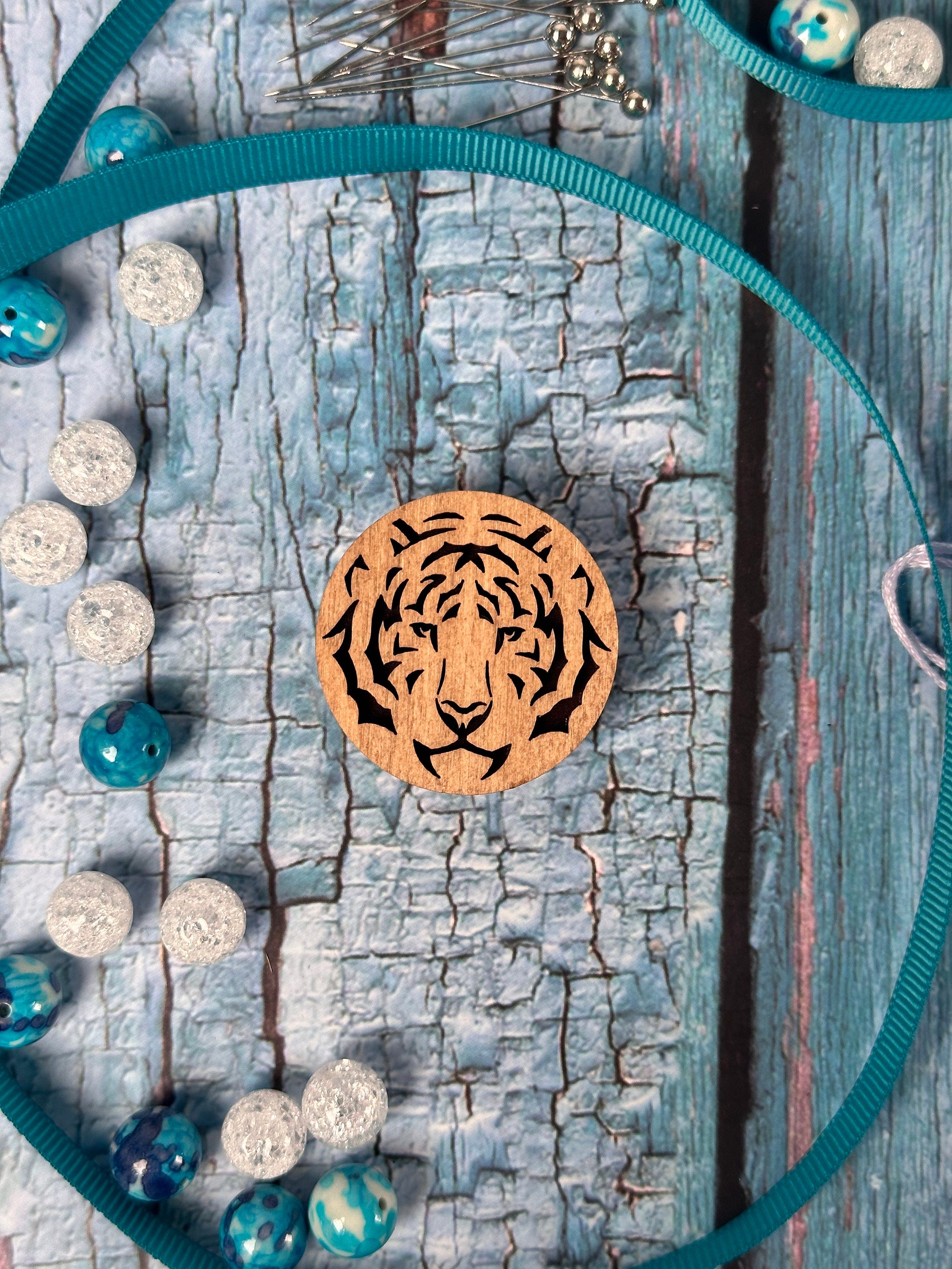 a necklace with a wooden flower on it