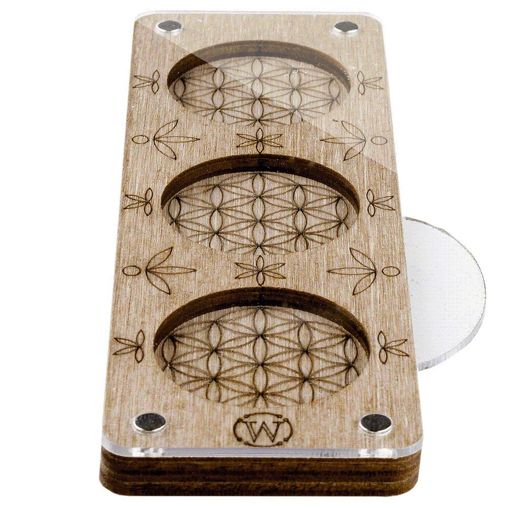 a close up of a wooden object with circles on it