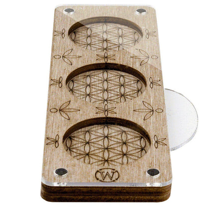 a close up of a wooden object with circles on it