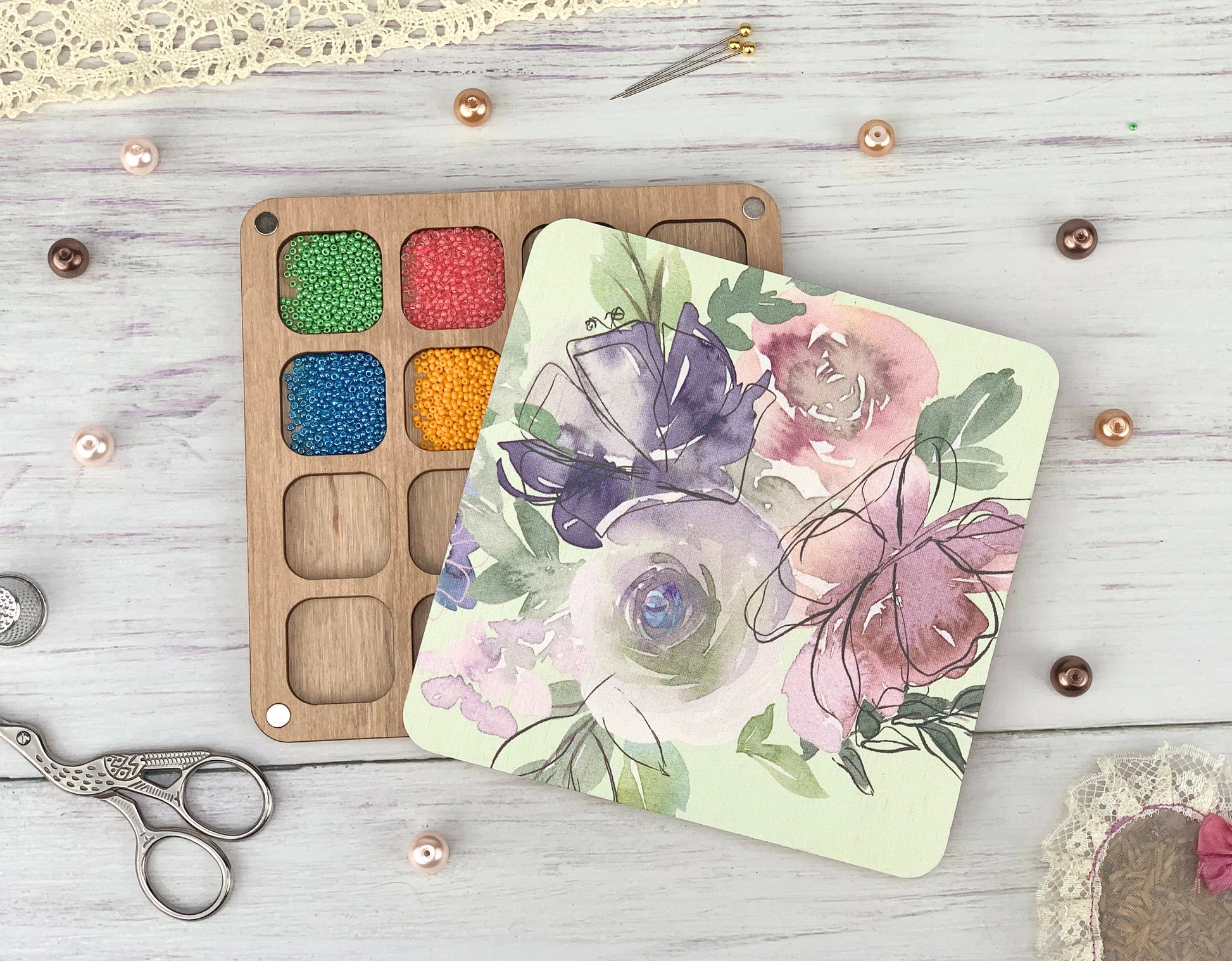 a table topped with craft supplies next to a pair of scissors