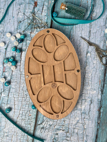 a wooden object sitting on top of a wooden table