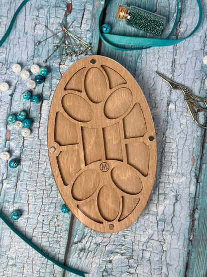 a wooden object sitting on top of a wooden table